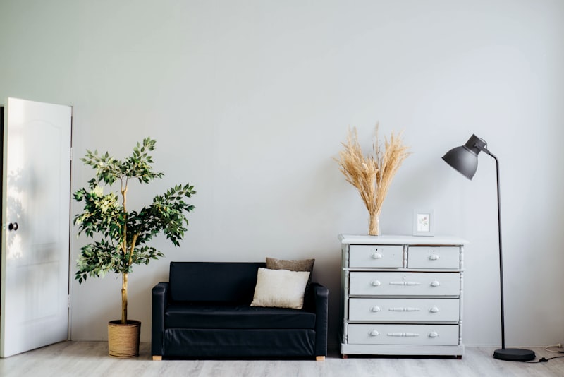 Dark room with minimalist modern geometric architecture, subtle lighting, sophisticated corporate backdrop, no people